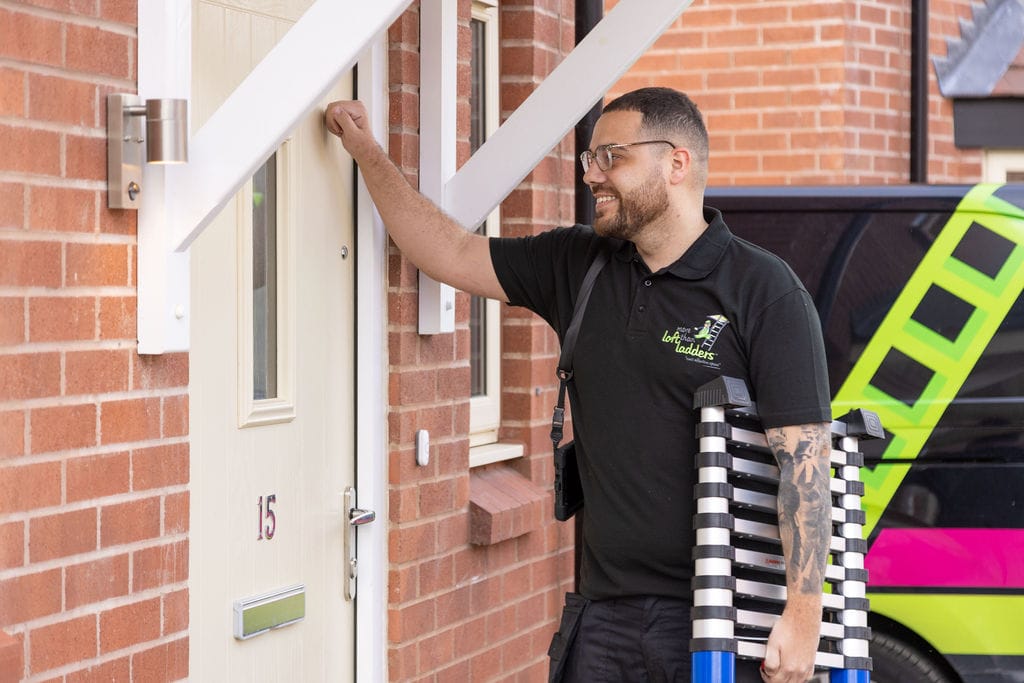 More Than Loft Ladders installer knocking on customer front door carrying loft ladder
